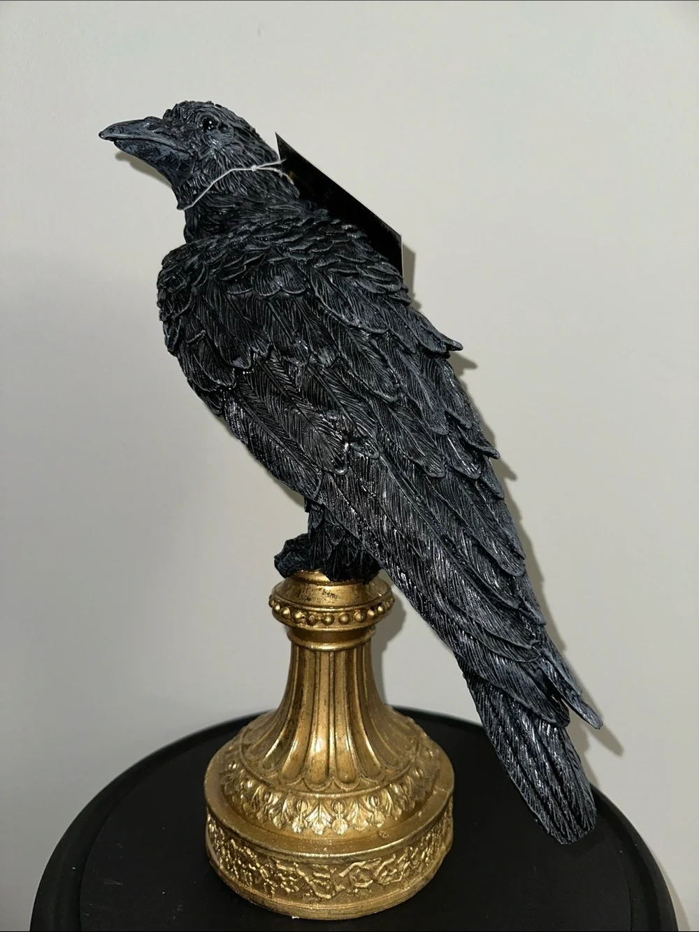 Black Decorative Raven Statue on Gold Pedestal - crow
